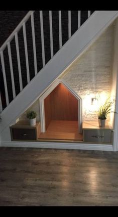 a dog house built under the stairs