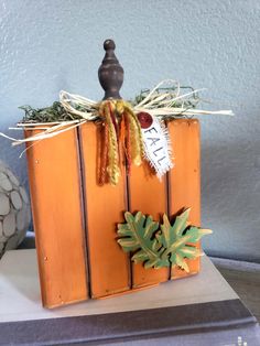 a wooden box with some decorations on it