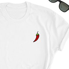 Chilli Beans Shirt, Chilli Shirt, Chilli t-shirt, Chilli Lover Gift, Spicy Minimalisti Shirt, Mexico Tee, Mexico Lover Unisex T-shirt You will fall in love with this unisex t-shirts, they feel soft and lightweight with the right amount of stretch, super confortable and flattering for both men and women. - 100% pre-shrunk cotton - Weight: 5.0 oz - Shoulder to shoulder tapping - Side-seamed Time for delivery - Processing and production time 1 to 6 business days (usually 2-3 days) - U.S Shipping ti Casual Shirt With Funny Print As Gift, Casual Shirt With Funny Print For Gift, Casual Tops With Funny Print For Gifts, White Casual T-shirt As Gift, White Casual T-shirt As A Gift, Casual White T-shirt As A Gift, Casual Crew Neck Shirt Perfect For Gifts, Casual White Shirt As Gift, Casual White Shirt As A Gift