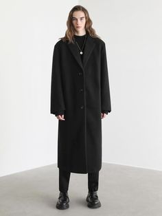 This is timeless and warm single-breasted coat designed for trendy and stylish oversized fit. It has voluminous silhouette and minimized lustrous surface for a more elevated look.- Notch lapels- Button fastenings- Two front welt pockets- Single vent- Internal pocket- Oversized fit - Unisex wear Oversized Classic Long Coat, Classic Oversized Long Coat, Sleek Oversized Winter Outerwear, Oversized Single Breasted Long Coat, Oversized Single-breasted Long Coat, Elegant Oversized Business Outerwear, Elegant Business Oversized Outerwear, Elegant Oversized Outerwear For Business, Oversized Solid Wool Coat For Work