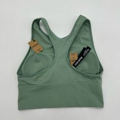 Sage Green, Soft And Stretchy. Very Light Fabric, Great For Working Out Or Everyday Wear Pet Friendly Smoke Free Home Casual Moisture-wicking Sports Bra In Seamless Fabric, Casual Stretch Sports Bra In Seamless Fabric, Green Seamless Supportive Activewear, Green Seamless Activewear With Medium Support, Casual Seamless Tank Top For Sports, Casual Stretch Seamless Sports Bra, Casual Solid Color Racerback Sports Bra, Casual Green Yoga Sports Bra, Green Seamless Training Top