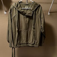 American Eagle Army Green Hoodie In Size Large. Kind Of A Lighter Denim Material. Button Detail On The Neckline And Ties On The Sides By The Hips. No Stains Or Rips In The Fabric. Only Worn Once Or Twice So It's Still In Excellent Condition. Items Come From A Very Pet Friendly Home! I Try My Best But There May Still Be Some Hair On The Garment. A Quick Wash And Lint Roll Once You Receive The Item Should Solve The Problem. All Items Come From A Smoke Free Home! All Items Are Laundered Prior To Sh Green Drawstring Tops For Fall, Green Long Sleeve Top With Drawstring, Green Casual Sweatshirt With Drawstring, Casual Green Sweatshirt With Drawstring, Green Casual Hoodie With Drawstring, Casual Green Hoodie With Drawstring, Trendy Washed Hoodie For Fall, Spring Hooded Washed Top, Spring Washed Hooded Top