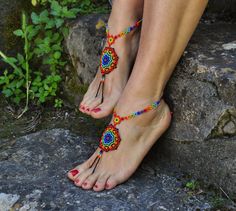 This listing is for a PAIR of beautiful and UNIQUE barefoot sandals handmade in the HUICHOL style. Made of high quality Japanese myuki seed beads and extra strong nylon thread. They make a beautiful combination with the leather sandals (pictures 4,7 and 10) also available in my shop. These sandals are very resistant and suitable for many environments. They will embellish your feet and you can wear it with sandals in a variety of styles from work to casual to evening attire. Beautiful to wear on Handmade Bohemian Red Sandals, Handmade Red Bohemian Sandals, Bohemian Toe Ring Sandals With Beads, Handmade Bohemian Sandals For Festival, Handmade Bohemian Festival Sandals, Bohemian Handmade Sandals For Festival, Multicolor Beaded Barefoot Sandals For Vacation, Traditional Handmade Toe Ring Barefoot Sandals, Traditional Beaded Sandals For Festivals