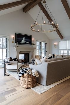 a living room filled with furniture and a fire place in the middle of a room