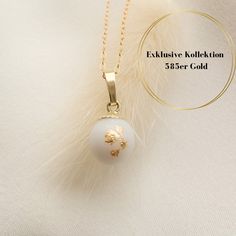 We create an enchanting piece of jewelry from your breast milk as a reminder of the beautiful time of breastfeeding. IN OUR EXCLUSIVE COLLECTION YOU WILL FIND JEWELRY MADE OF SOLID GOLD. The 8 mm large pearl looks particularly elegant, the pendant loop and the pearl cup are made of 585 yellow gold. We would be happy to incorporate hair into the pearl. You are only buying the pearl including the pendant loop and the pearl cup, both made of 585 yellow gold. For a 585 yellow gold chain, please cont White Round Pendant Jewelry Gift For Her, White Pearl Charm Jewelry Gift For Her, White Pearl Charm Jewelry As A Gift For Her, White Jewelry With Birthstone For Keepsake, White Birthstone Jewelry For Keepsake, Pearl White 14k Gold Jewelry Gift, White Birthstone Necklace For Keepsake, White Jewelry With Birth Flower For Her, White Birth Flower Jewelry For Her