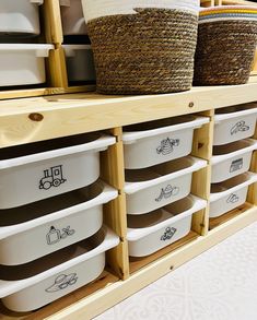 some baskets are sitting on top of the shelves