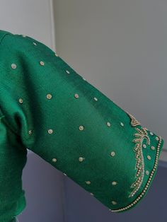 Green Color Raw Silk Readymade Blouse with beautiful Handwork Work in beads and Zircon. Item : Readymade BlouseReady-to-Wear : YesSize : 36 (Can be opened to Size 40)Color : Bottle Green Blouse Fabric : Raw Silk Lining : Yes, it is fully lined Padded or Non-Padded : PaddedClosure: Front Closure with hooks.Disclaimer - : -This is a Standard Size blouse. We do not guarantee perfect fit as every body and shape is different. Little or no alteration would be required to get the perfect fit. - Color v Long Sleeve Blouse With Pearl Embroidery For Wedding, Long Sleeve Wedding Blouse With Pearl Embroidery, Festive Long Sleeve Blouse With Pearl Embroidery, Traditional Long Sleeve Blouse With Pearl Embroidery, Elegant Festive Embroidered Short Sleeve Top, Bollywood Festive Blouse With Pearl Embroidery, Festive Bollywood Blouse With Pearl Embroidery, Elegant Tops With Pearl Embroidery For Festivals, Fitted Blouse With Pearl Embroidery For Festivals