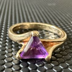 Item: 10k Trillion Amethyst Vintage Classic Statement Ring Size 7.5 Yellow Gold Composition: 10k Gold Marked Condition: Estate:Good Weight: 3.5g Ring Size: 7.5 14k Yellow Gold Amethyst Ring With Accent Stones, Gold Trillion Cut Gemstone Ring, Fine Jewelry 14k Gold Amethyst Ring With Accent Stones, Fine Jewelry Amethyst Ring In Yellow Gold, Amethyst Yellow Gold Rings Fine Jewelry, Fine Jewelry Amethyst Birthstone Ring In Yellow Gold, Wedding Amethyst Ring In Polished Yellow Gold, 14k Gold Amethyst Ring With Accent Stones, Yellow Gold Amethyst Gemstone With Accent Stones