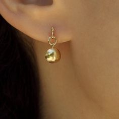 Delicate 14k gold earrings, classy and timeless, handmade by Sigal Gerson Recycled Yellow Gold Huggie Earrings, Yellow Gold Huggie Earrings In Recycled Gold, Polished Yellow Gold Earrings In Recycled Gold, Yellow Gold Earrings With Polished Finish From Recycled Gold, 14k Gold Dangle Huggie Earrings, Polished Yellow Gold Earrings Of Recycled Gold, Pierced Yellow Gold Earrings In Recycled Gold, Polished Recycled Gold Round Earrings, 14k Yellow Gold Huggie Dangle Earrings