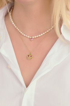 Show your love. Our Lover Pearl Necklace features a single bezel set heart shaped gemstone in the color of your choosing strung onto a strand of freshwater pearls with a 14K Yellow Gold clasp closure. The ruby, emerald & sapphires are lab created stones. Pearl Jewelry With Heart Charm And Round Beads, Yellow Gold Heart Jewelry With Pearl Charm, Heart-shaped Yellow Gold Jewelry With Pearl Charm, Pearl Heart Pendant Jewelry With Heart Charm, Heart-shaped Pearl Chain Jewelry For Valentine's Day, Valentine's Day Pearl Jewelry With Pearl Chain, Pearl Drop Heart Pendant Jewelry, Valentine's Day Heart Pendant Jewelry With Pearl Drop, Valentine's Day Pearl Chain Jewelry Gift