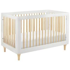 a white crib with wooden slats on the top and bottom, against a white background