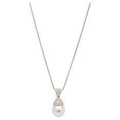 Brand: Mikimoto Gender: Ladies Metal Type: Platinum Pendant Length: 1.00 Inches Chain Length: 17.50 Inches Pendant Diameter: 12.00 mm Chain Width: 1.25 mm Pendant Weight: 5.36 grams Chain Weight: 5.65 grams 950 platinum diamond and pearl drop pendant. The metal was tested and determined to be 950 platinum. Engraved with "PT950". The "Mikimoto" trademark (or hallmark) can also be found on the item. 950 platinum wheat link chain. The metal was tested and determined to be 950 platinum. Engraved wit Elegant Diamond White Necklace With Chain, Elegant Diamond White Diamond Necklace, Elegant Silver Pearl Necklace With Chain, Elegant White Gold Pearl Necklace, Classic Diamond Necklace With Pearl Chain For Formal Events, Elegant Jewelry Chain For Anniversary, Elegant Chain Jewelry For Anniversary, Formal Pearl Necklace With Chain, White Chain Jewelry For Formal Occasions