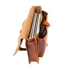 Materials: 100% English Saddle leather exterior. 100% cotton lining interior. Dimensions: 8L capacity. W37cm x H28cm x D8cm, top handle: H4cm W3cm, extendable shoulder strap: L78cm-L145cm. Hardware: Brass fittings and robust YKK zippers. Features: 15″ laptop capacity, extendable detachable shoulder strap, top handle, back zip pocket, internal zip pocket, front leather pouch style pocket, buckle fastening to the main compartment. The classic Messenger in our new Tan English Saddle Leather makes f Classic Saddle Bag With Leather Trim Satchel Shape, Casual Travel Satchel With Leather Lining, Travel Saddle Bag With Leather Trim And Top Handle, Top Handle Saddle Bag With Leather Trim For Travel, Leather Trim Saddle Bag With Top Handle For Travel, Classic Rectangular Saddle Bag With Leather Trim, Leather Trim Top Handle Saddle Bag For Travel, Casual Leather Laptop Bag With Adjustable Strap, Leather Saddle Bag With Adjustable Strap For Daily Use