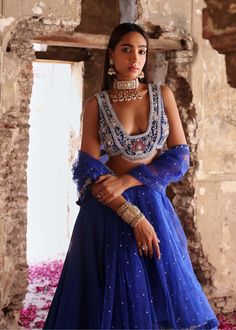 Experience the epitome of elegance with this embellished choli paired seamlessly with an embellished lehenga and dupatta. This ensemble exudes grace and sophistication, boasting intricate embellishments that captivate attention. Perfect for weddings, receptions, or any special occasion where you want to make a stunning impression. Embrace timeless beauty and elevate your style with this exquisite outfit that promises to leave a lasting impression. Blue Dress Gold Accessories, Gold Accessories Outfit, Embellished Lehenga, Drake Quotes, Maternity Shoots, Accessories Outfit, Gold Bangles For Women, Weddings Receptions, Royal Blue Dress