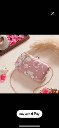 Our Pastel Pink Printed Sequin clutch is a must-have for this season! From lehengas to Indo-western, this clutch is capable of giving you the regal & chic look. Be ready to handle the spotlight! Embroidered front. Dimensions (LxB): 8"x4 Handle length: 47" Material: Embroidered poly silk, poly satin lining, metal clutch frame, gold metal sling. Features: metal lock closure, detachable metal sling. Handheld Shoulder Bag For Spring Formal Events, Summer Evening Clutch With Detachable Handle, Pink Box Bag, Elegant Handheld Box Bag For Spring, Pink Formal Clutch Box Bag, Spring Party Shoulder Bag Clutch, Spring Formal Clutch Bag, Party Clutch For Spring Season, Pink Box Bag With Detachable Handle For Party