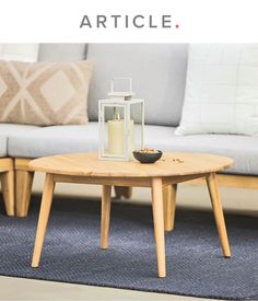 a coffee table sitting on top of a blue rug