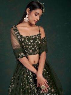 <ul>
<li style="text-align: justify;">Be the sunshine of everyone's eyes dressed in this olive green color lehenga crafted with georgette material accomplished with sequins work and zari work.</li>
<li style="text-align: justify;">This olive green lehenga arrives with a similar color choli made with georgette material designed with sequins work and zari work. It also arrives with a similar color soft net material dupatta completed with a sequins work and zari work.</li Green Embroidered Party Wear Dupatta, Festive Green Dress With Unstitched Blouse, Green Lehenga With Intricate Embroidery For Festive Occasions, Festive Green Lehenga With Intricate Embroidery, Pista Green Lehenga With Intricate Embroidery For Party, Fitted Green Anarkali Set With Intricate Embroidery, Green Designer Party Wear Sets, Elegant Green Choli With Sheer Dupatta, Elegant Green Choli With Intricate Embroidery