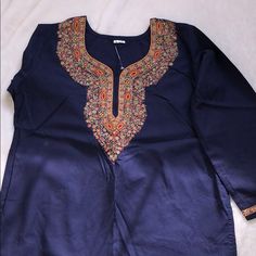 Brand New Never Worn Beautiful Navy Blue Blouse With Long Sleeves Hand Made Detailed Embroidery. Pictures Do Not Do It Justice. Size Large. Blue Bohemian Blouse For Eid, Bohemian Blue Blouse For Eid, Traditional Blue Top For Eid, Long Sleeve Blue Tops For Eid, Blue Embroidered Blouse For Festive Occasions, Festive Blue Embroidered Blouse, Festive Embroidered Blue Blouse, Blue Traditional Top With Resham Embroidery, Festive Blue Embroidered Top With Intricate Details