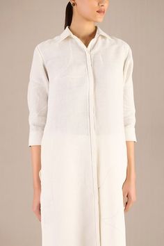 Ivory rolled up three fourth sleeves collared tunic with tonal bloom embroidery and a curvilinear hemline. Paired with a pant. - Aza Fashions White Blouse With Concealed Placket For Spring, Long Sleeve Linen Kurta For Work, Bloom Embroidery, Tunic With Pants, Pant Women, Women Kurta, Straight Kurta, Collar Neck, Embroidered Tunic