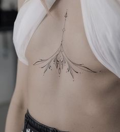 a woman with a tattoo on her chest