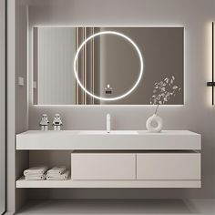 a bathroom with a sink, mirror and towel rack in it's center area