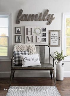 a bench with pillows and pictures on the wall