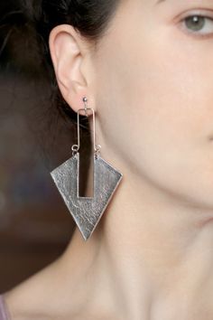 Long triangle earrings in silver color Clip on dangles for bold women Statement jewelry Triangular arrow shape Big non pierced earrings by GitasJewelryShop https://www.etsy.com/listing/648516807/long-triangle-earrings-in-silver-color?ref=rss Modern Drop Earrings, Metal Chandelier Earrings, Modern Clip-on Drop Earrings, Modern Single Drop Plug Earrings, Metal Chandelier Drop Earrings, Modern Dangle Plug Earrings For Party, Modern Metal Dangle Clip-on Earrings, Metal Dangle Wrap Earrings For Pierced Ears, Metal Wrap Dangle Earrings For Pierced Ears