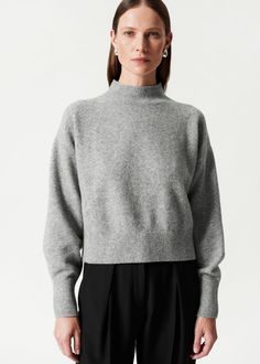 Mock-neck knit sweater with dropped shoulders and a straight silhouette. • Ribbed neckline, cuffs and hem Length of sweater: 50cm / 19.7” (Size S) Skirt And Blouse, Swimwear Shorts, Ribbed Neckline, Clothing Essentials, Sweaters Knitwear, Mock Neck Sweater, Fashion Story, Short Jacket, Feminine Style