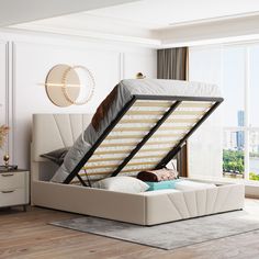 a bed that is in the middle of a room with a mattress on top of it