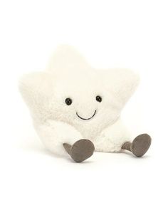 a white stuffed animal sitting on top of a white floor