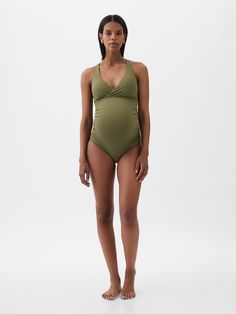 Soft, stretch maternity one-piece swimsuit.  Wrap-style V-neck.  Adjustable tank straps.  Tie at back.  This one-piece is made with 83% recycled polyester.  Less waste in the world.  More great swimsuits for you.  Please note: Maternity styles cannot be returned in store.  Please enjoy free returns by mail.  Choose your maternity Summer Swimwear By Gap, Gap Summer Swimwear For The Pool, Gap Summer Swimwear For Pool, Summer Pool Swimwear By Gap, Gap Swimwear For Summer Pool Season, Gap Swimwear For Summer Pool Time, Gap Swimwear For Summer Pool, Gap Swimwear For Pool In Summer, Gap Swimwear For Pool And Summer