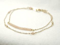 Double strand beaded bar bracelet - dainty jewelryTiny baby pink beads beaded on 14K gold filled chain.  Double chain bracelet that's femininely dainty in soft shades of gold and blushing pink.  >>>measurements<<<bead bar length 1"please choose length at checkout♦you can enter shop here!http://etsy.com/shop/illusy Dainty Pink Bracelets With Adjustable Chain, Pink Dainty Bracelet With Adjustable Chain, Dainty Pink Bracelet With Adjustable Chain, Dainty Pink Gold Jewelry For Everyday, Dainty Pink Beaded Chain Bracelet, Delicate Pink Everyday Bracelet, Delicate Beaded 14k Gold-filled Bracelets, Delicate Pink Beaded Chain Jewelry, Delicate Beaded Bracelets With Adjustable Chain