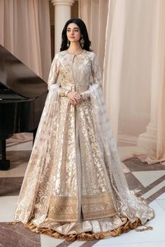 Wedding Anarkali Set With Floral Embroidery, Wedding Anarkali Set With Floral Embroidery In Tissue Silk, Semi-stitched Gold Dress With Floral Embroidery, Elegant Gold Wedding Dress For Festive Occasions, Eid Wedding Dress With Gold Embroidery, Semi-stitched Wedding Dress With Sheer Dupatta For Ceremony, Elegant Wedding Dress With Resham Embroidery For Festive Occasion, Festive White Gown With Gold Embroidery, Gold Wedding Dress For Festive Ceremony