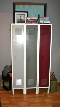 two lockers are next to each other on the floor in front of a bookshelf