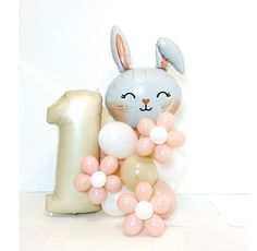 a balloon bunny with balloons in the shape of 1