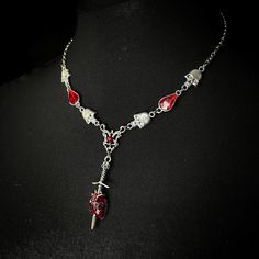 Betrayed necklace (Limited edition) Sinister themed necklace with hanging skull and blood drop design on a stainless steel chain. Handmade to order; ready in 3-4 days. May take longer during busy times. Halloween Stainless Steel Chain Necklace, Gothic Clavicle Chain Necklace For Halloween, Gothic Halloween Necklaces With Adjustable Chain, Halloween Gothic Necklaces With Adjustable Chain, Gothic Halloween Clavicle Chain Necklace, Halloween Gothic Necklace With Adjustable Chain, Gothic Halloween Necklace With Lobster Clasp, Gothic Metal Dangle Necklaces, Gothic Heart-shaped Jewelry With Adjustable Chain