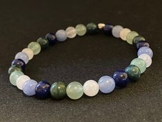 Genuine lapis, jade, green moss agate and green aventurine beads come together to create the MLM Pride flag. Beads are 6mm. Bracelet is 6.75 inches inner length around and made with crystal stretch elastic cord. Mlm Flag Bracelet, Mlm Pride Flag, Mlm Flag, Flag Beads, Pinterest Wardrobe, Green Moss Agate, Star Bracelet, Themed Jewelry, Pride Flag