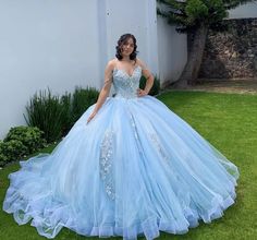 Step into a world of grace and grandeur with this enchanting Sky Blue Off-the-Shoulder Quinceanera Dress. The exquisite ball gown silhouette exudes royal elegance, while the sweeping chapel train ensures a dramatic and unforgettable entrance. The romantic off-the-shoulder neckline highlights your shoulders and neckline, adding a touch of timeless sophistication. It is crafted from soft tulle fabric and is adorned with intricate lace appliques and sparkling beadings, creating a stunning blend of Light Blue Quince Dress With Butterflies, Blue 15 Dresses Quinceanera, Sky Blue Ball Gown, Sky Blue Quinceanera Dresses, Blue Birthday Themes, Quinceanera Dresses Off The Shoulder, Blue Quince Dress, Light Blue Quinceanera Dresses, Sky Blue Wedding