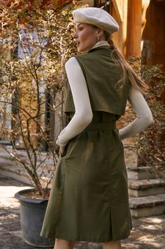 This stylish belted trench has been accented with large tortoise buttons, a matching fabric belt, and an elegant lapel-collar. Designed in a sleeveless midi silhouette it's easy to style with a camisole, blouse, or fitted turtleneck. Content: 100% Linen Hand wash warm Button-down style Belted Unlined Length: S = 119 cm (46.5") M = 122 cm (47.5") L = 125 cm (49") XL = 128 cm (50") 2XL = 130 cm (50.5") 3XL = 132 cm (51.5") Chic Fall Belted Dress With Belted Cuffs, Spring Knee-length Outerwear With Hidden Button Closure, Chic Belted Dress With Pockets, Knee-length Outerwear With Hidden Button Closure For Spring, Chic Belted Summer Outerwear, Spring Workwear Belted Dress, Sleeveless Khaki Outerwear For Work, Spring Sleeveless Outerwear With Hidden Button Closure, Knee-length Belted Outerwear For Work