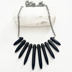 Dubbed as spikes, bullets, spears, or points - it's definitely a beloved silhouette. These magnesite spikes are arranged in a fan shape, adding an elegant yet edgy touch to any style. Magnesite stones on stainless steel chain 18.5"L Spike Necklace, Black Stone, Spears, Steel Chain, Stainless Steel Chain, Earring Necklace, Stretch Bracelets, Necklaces Bracelets, Shopping Outfit