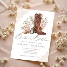 a wedding card with boots and flowers on it