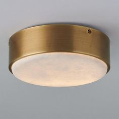 a close up of a light fixture on a ceiling