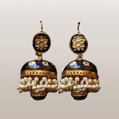 Enhance your style with these exquisite traditional jhumka earrings, beautifully crafted with a gold-plated finish, black enamel detailing, and delicate pearl accents. These earrings are a timeless piece of jewelry that embody the rich cultural heritage of India and Pakistan. Perfect for adding a touch of elegance and sophistication to any outfit, these jhumkas are ideal for weddings, festivals, or any special occasion where you want to make a statement. Features: Classic Jhumka Design: These earrings feature the traditional jhumka shape, a bell-like design that is a staple in South Asian jewelry. The intricate detailing adds a vintage charm to these stunning earrings. Gold-Plated Finish: Made from high-quality gold-plated alloy, these earrings provide a luxurious look while being durable Jhumka Design, South Asian Jewelry, Traditional Jhumka, Cultural Heritage Of India, Jhumka Designs, Asian Jewelry, Faux Pearl Earrings, Pakistani Jewelry, India And Pakistan