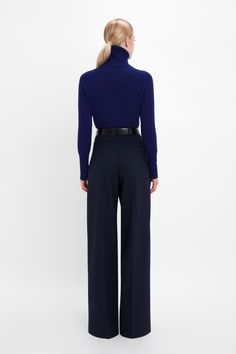 A lambswool polo neck with saddle shoulder design, this textured knit has a contrasting ribbed neck that sits just below the jawline for a dramatic silhouette. A contrasting embroidered Victoria Beckham monogram adds a discrete point of interest. Styled with the Wide Leg Trouser, Jumbo Frame Belt and Chain Pouch With Strap in Croc Leather Victoria Beckham Polo Neck Jumper In Navy  - Size L UK Dramatic Silhouette, Mask Sunglasses, Belt Chain, Size 12 Uk, Croc Leather, Polo Neck, Shoulder Design, Textured Knit, Victoria Beckham