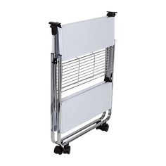 a white wall mounted heater sitting on top of a metal rack