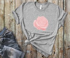 ** UNISEX T-SHIRT ** Rose Shirt, Floral Shirt, Rose T-Shirt, Boho Rose Shirt, Flower Shirt, Pink Flower Shirt, Red Floral Shirt, Red Rose, Pink Rose, Garden Tee This Bella + Canvas 3001 Unisex Premium T-Shirt is as comfortable as you can imagine. It feels soft and lightweight, with the right amount of stretch. It's comfortable and flattering for both men and women. We can't compliment this shirt enough - it's one of our crowd favorites. And it's sure to be your next favorite too! 100% combed and Rose Print Tops For Spring, Rose Print Tops For Summer, Casual Rose Print Tops In Rose Color, Casual Rose Cotton Top, Casual Rose Print Tops, Casual Rose Tops With Rose Design, Rose Shirt Design, Rose Color Crew Neck Top With Rose Print, Rose T Shirt Design