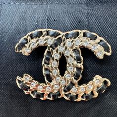 This Is An Authentic Chanel Lambskin Crystal Vintage Allure Cc Chain Brooch In Black And Gold. This Elegant Brooch Features A Textured Gold Cutout Chanel Cc Setting That Is Lined With Black Leather And Crystals. This Is An Excellent Brooch With A One Of A Kind Look, From Chanel! Longest Length : 1.75 In Height: 1.50 In Comes With Chanel Box No Tags Luxury Black Brooches For Formal Occasions, Chic Gold Brooch For Evening, Luxury Black Brooch For Evening, Chic Black Brooches For Parties, Chic Black Party Brooches, Chain Brooch, Elegant Brooch, Chanel Box, Chanel Jewelry