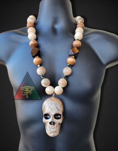 Our Homage to Our Ancestors Skull Necklace is an original design created by Eye Create LLC.  The Skull piece is crafted and painted by hand as well as every bead on the necklace hand painted and engraved.  This piece is definitely one of a kind and can only be found at Eye Create LLC.  Please note that since every piece is handmade, no two pieces will look exactly the same. ❗️❗️❗️❗️PLEASE READ❗️❗️❗️❗️ Skull color and beads can customized. Please contact me with personalizations BEFORE purchasing Unique Handmade Skull Necklace, Create Llc, Skull Color, Wooden Bead Necklace, Mens Necklace Pendant, Astrology Necklace, Cream Cakes, Wooden Bead Necklaces, African Necklace