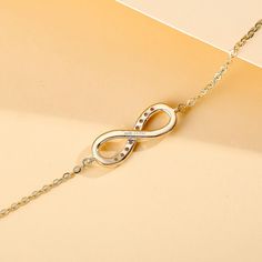 Classic infinity bracelet design with a meaning of eternity behind it. Traditional love symbol for holiday that celebrates your forever love. Pendant size: width 16 x 15 mm Total Diamond Weight: 0.072 CTTW (I-J Color, SI Clarity) Chain Length: 16.7"+1.2" Total Weight: 1.4g Origin: Imported Elegant Gold Bracelet For Mother's Day Gift, Elegant Rose Gold Bracelet For Mother's Day, Elegant Rose Gold Infinity Bracelet, Flexible White Gold Bracelet As A Gift, Formal Infinity Bracelets In Fine Jewelry Style, Formal Infinity Bracelet In Fine Jewelry Style, White Gold Infinity Bracelet For Formal Occasions, Infinity Symbolic Jewelry For Gift, Symbolic Infinity Jewelry For Gift