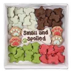 small and spoiled dog treats in a white box with the words small and spoiled on it